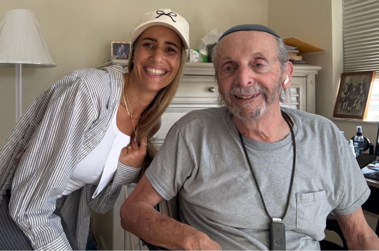 Volunteer and senior smiling